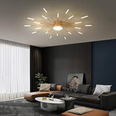Modern living room with a ceiling light fixture, dark sofa, and decorative elements.